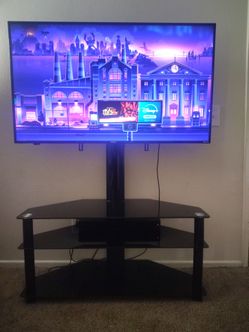 50 inch Roku Tv, 3 shelf corner swivel black glass tv stand & soundbar