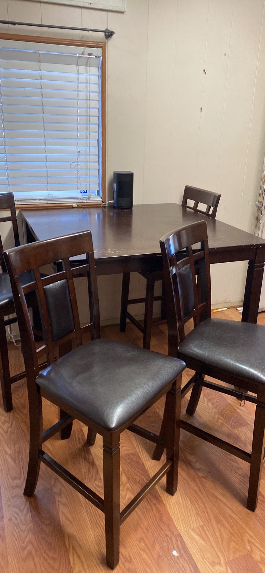 High top dining table with four chairs