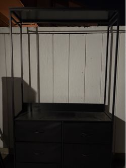 Dresser with a rod for hanging clothes $40