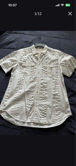 It’s very good shirt for man’s in size Large the color is white made by Burberry