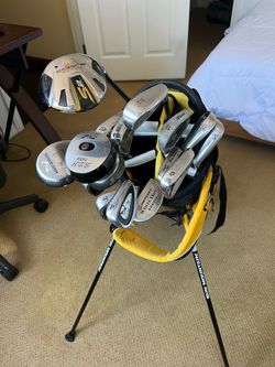 Golf clubs + bag + new balls + tees + markers + divot