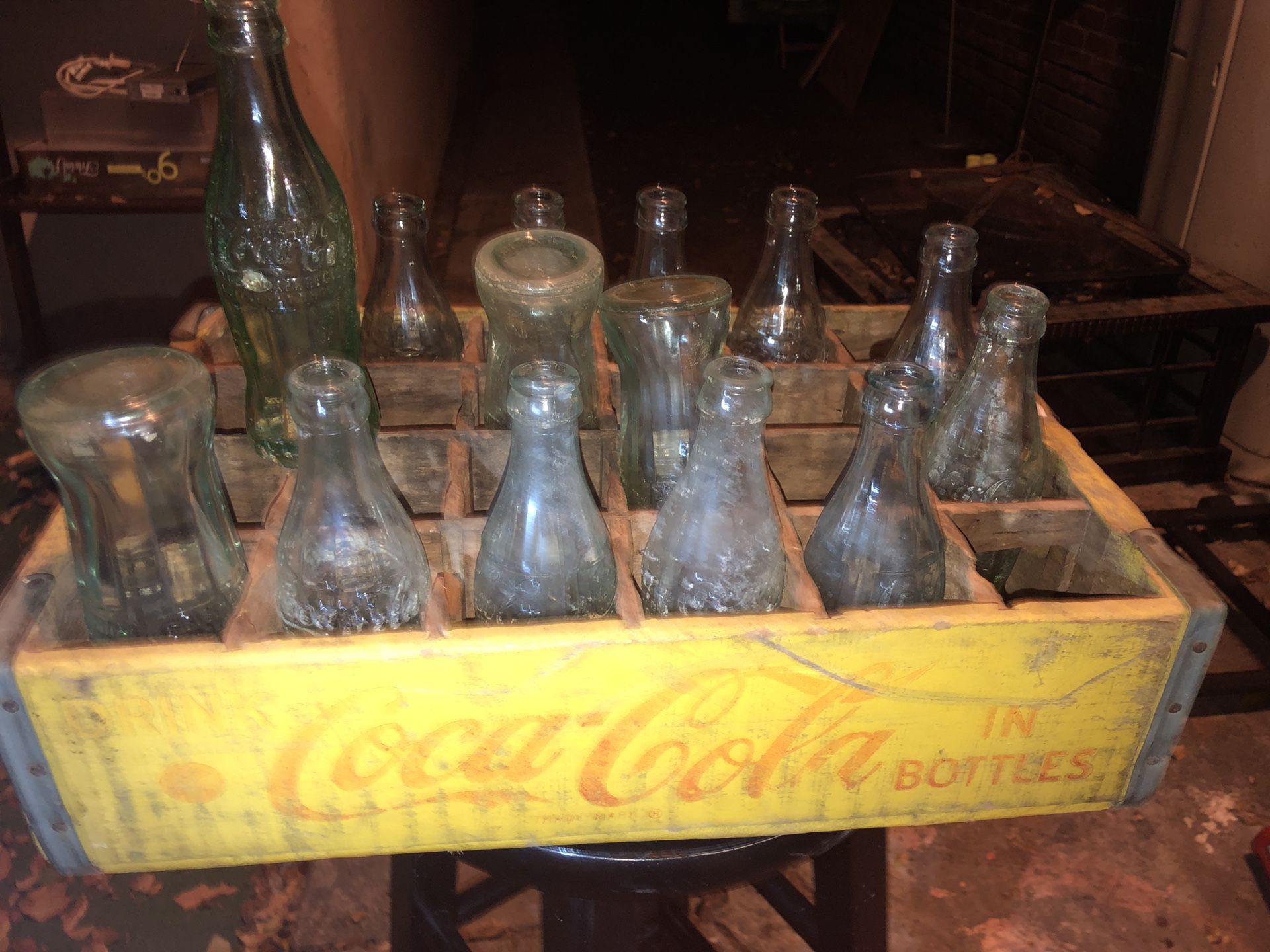 1915 coke cola glass bottles and coke carrying tray
