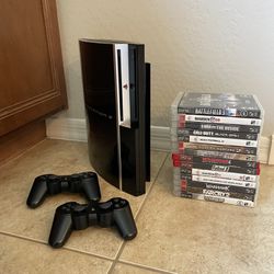 PS3 with 2 Controllers and 14 Games