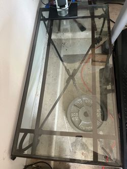Glass top coffee table with metal