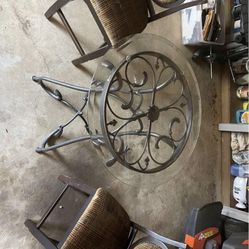 Glass table and two chairs