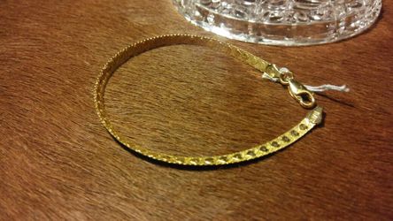 Gold over sterling silver.