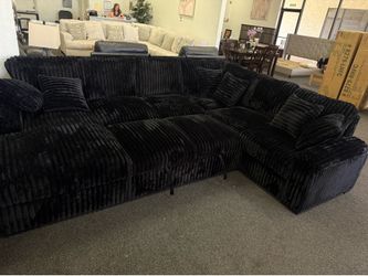 Large black corduroy sectional with storage and sleeper