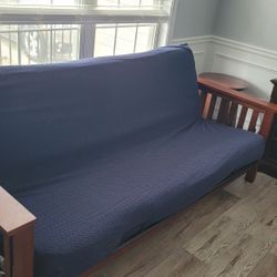 Wooden Futon With Blue Waterproof Cover