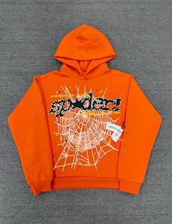 Orange Spider Worldwide hoodie with white spiderweb graphic and 'SPIDER!' text