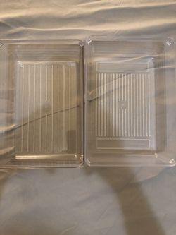 Set of 2 clear plastic storage containers. Size 6X8.5 inches