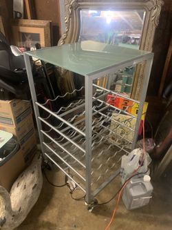 Wine 60 wine rack. On roller excellent condition.