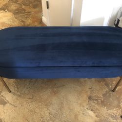 Blue velvet storage bench