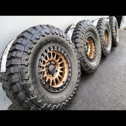 17" KMC IMS KM552 w/ 35x12.50R17 Toyo Open Country MT tires