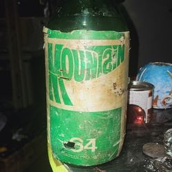 Antique   64oz Mountain  Dew Bottle 