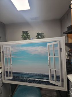 Open window view blue shining sea frame.  Used-good Condition