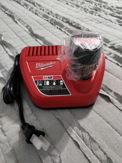 NEW Milwaukee battery and charger