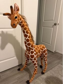 Two large decorative stuffed animal giraffes
