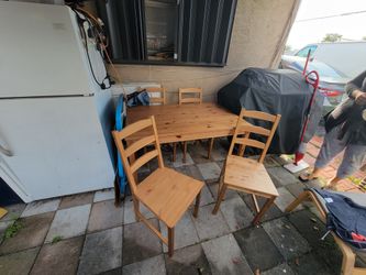 four-seater wooden dining set