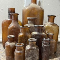 12 old antique Medical Bottles 