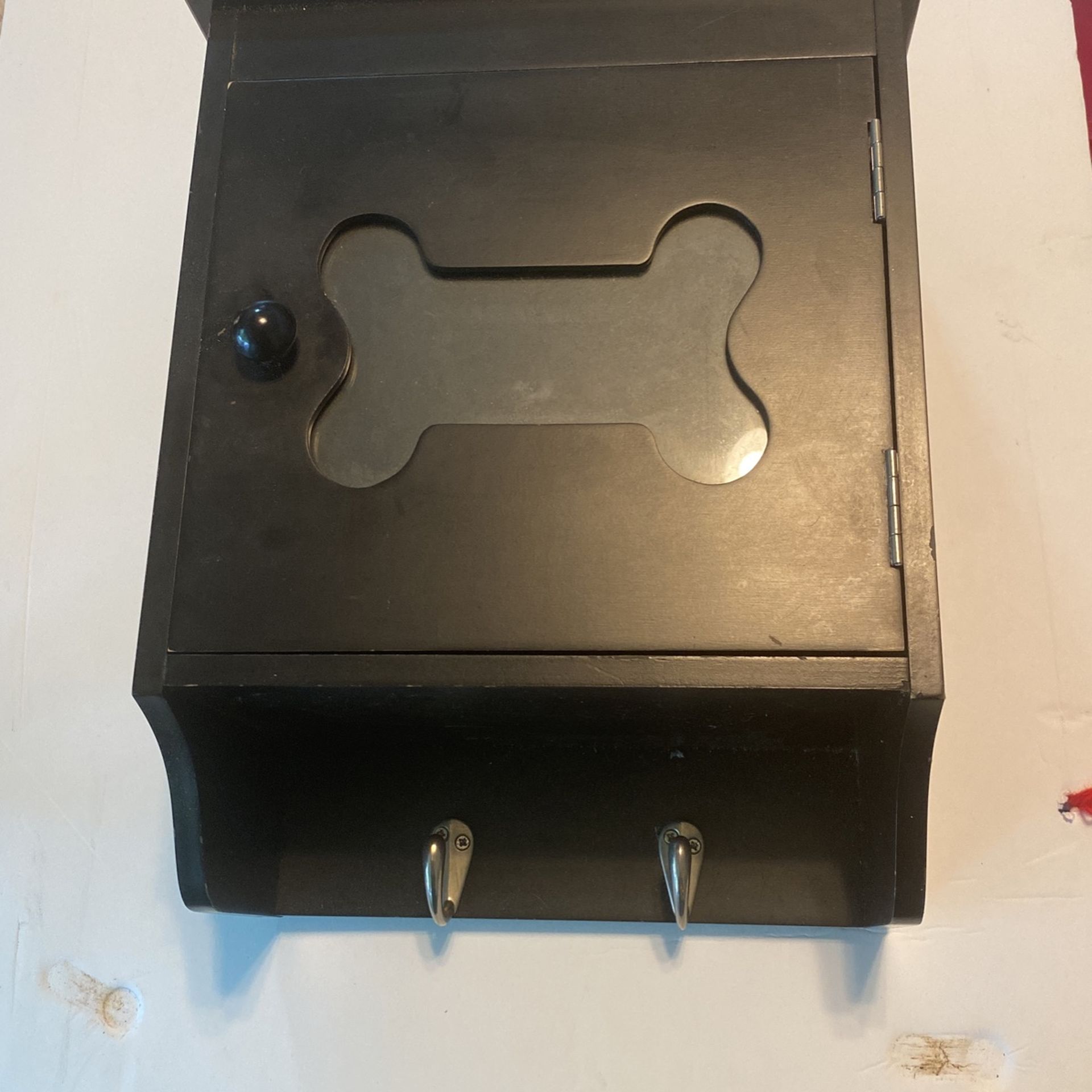 All Wood dog storage compartment you can hang leashes or collars off the hooks or keys and put a image in the cover