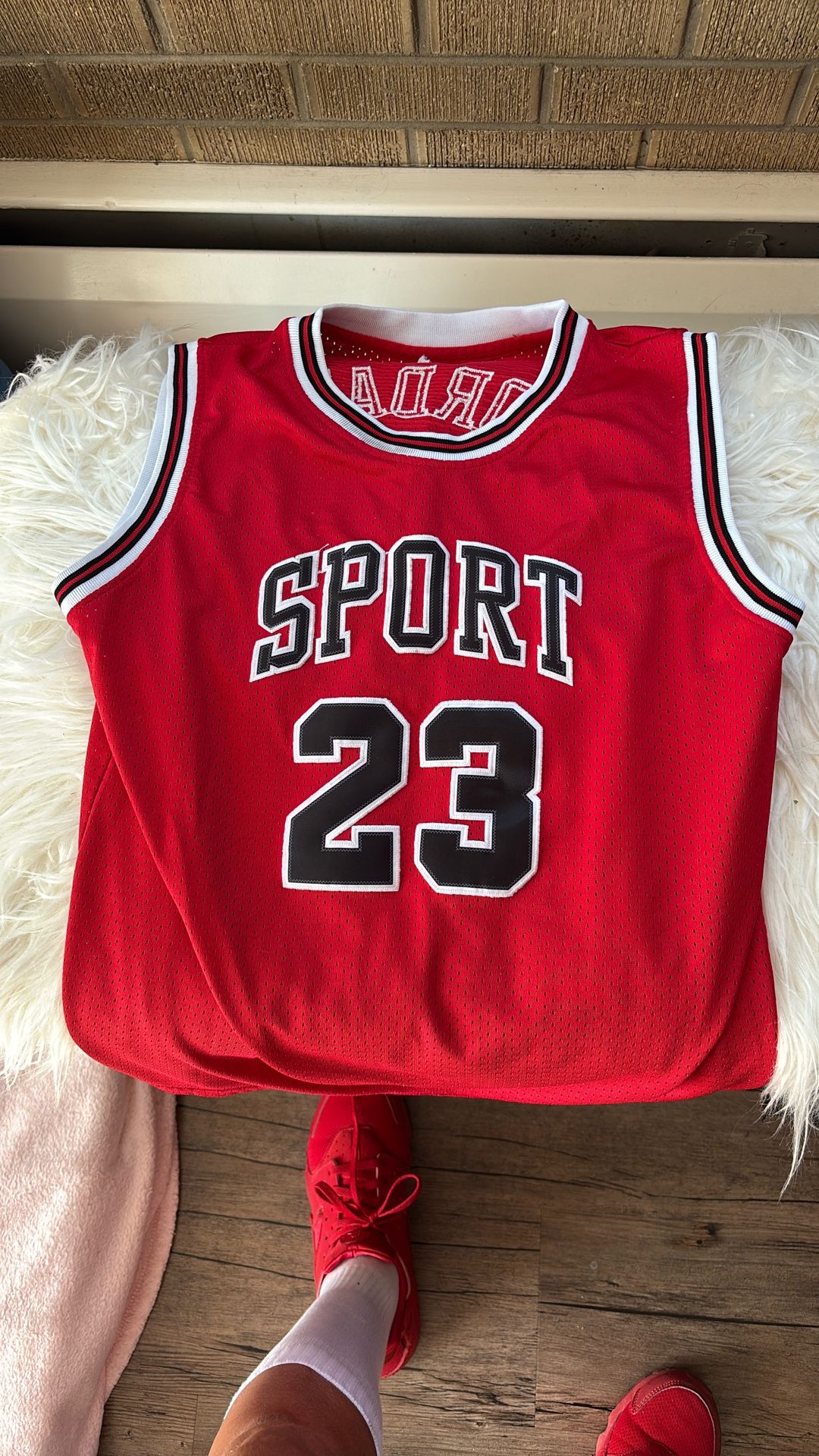 Red and white and black Jordan sport 23 jersey