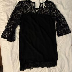 Woman’s Black Dress 
