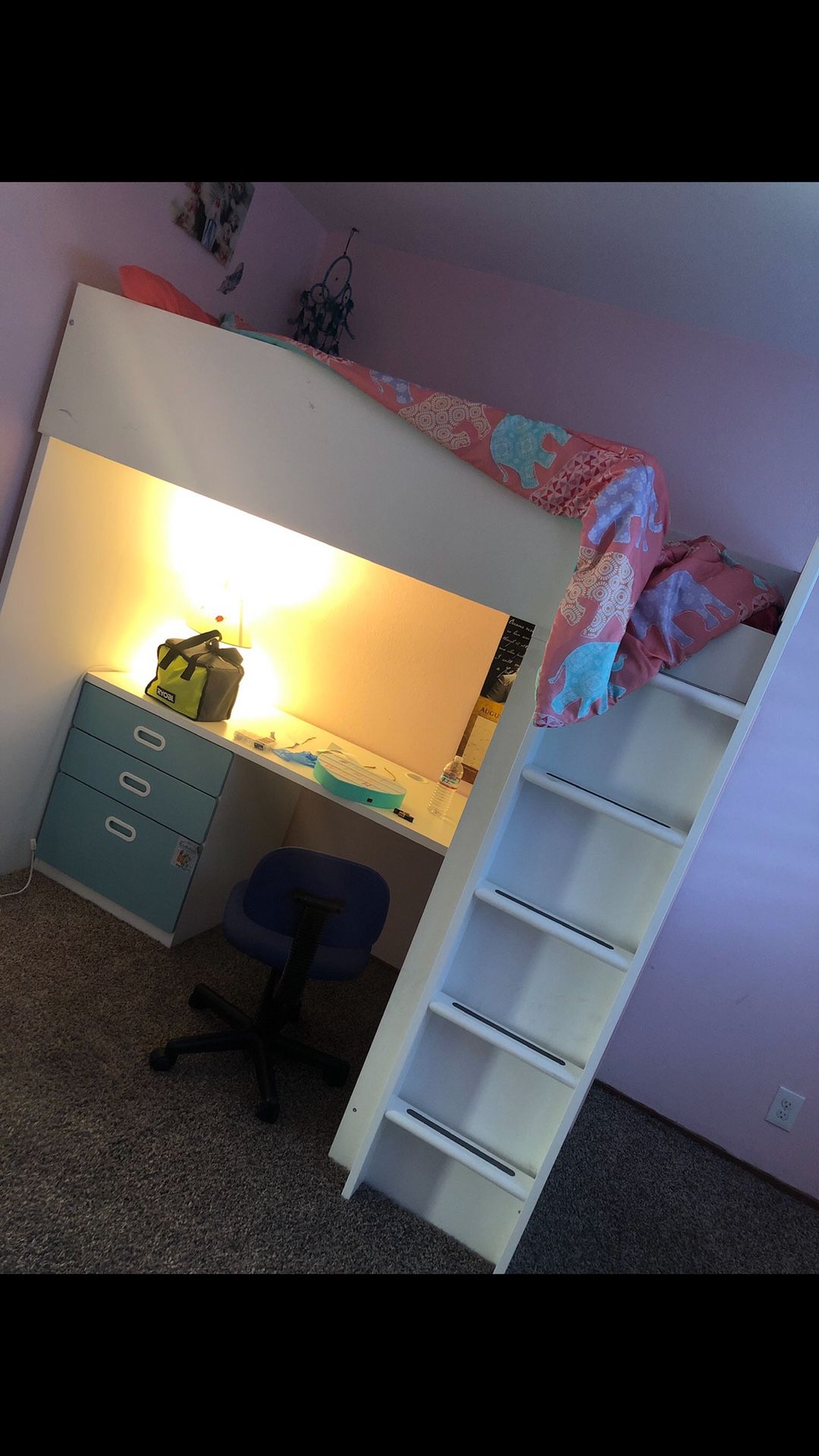 A loft bed with desk