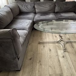 Gray Sectional Couch + Oval Glass Table