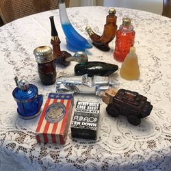 12 vintage Avon aftershave bottles and decanters. 