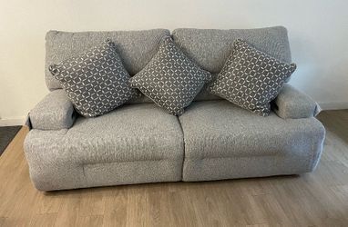 Gray Fabric Reclining Sofa with Accent Pillows