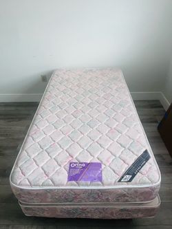 Twin bed with wheeled base