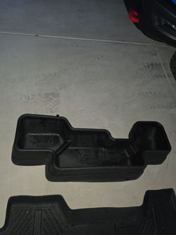 Storage  under rear seat ram
