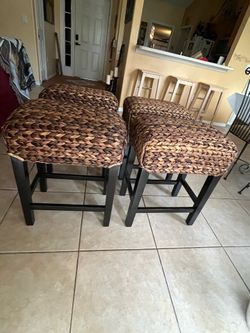 Rattan dark brown small chairs.
