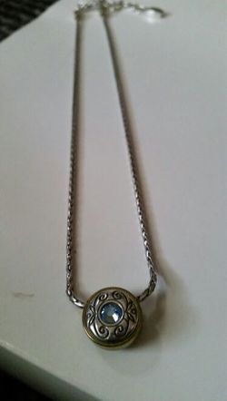 Silver necklace with blue gem