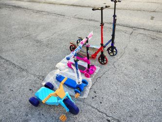 Set Of New Kids Scooters And Tricycle