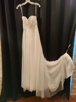 New wedding dress, never used. Has tags size 4