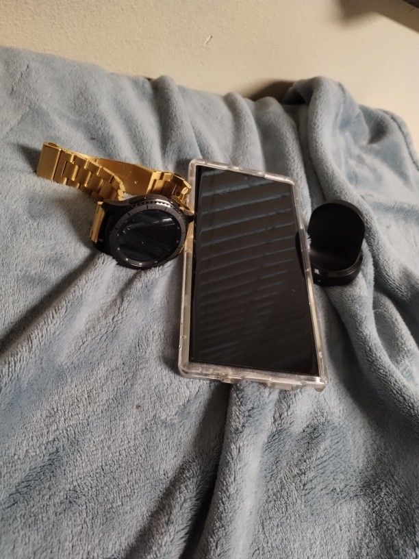 A Galaxy S10 Note Plus And A Samsung Watch R3 Frontier And Different Watch Bands For It And Comes With Chargers