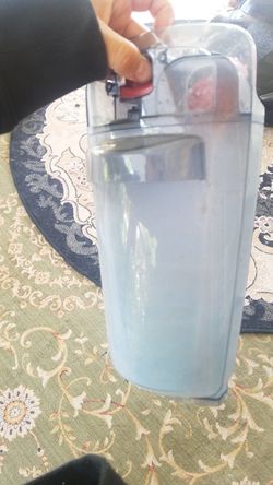 Canister for floor vacuum