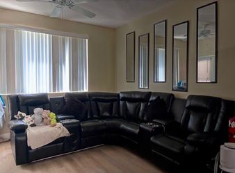 Black leather sectional sofa with LED lights
