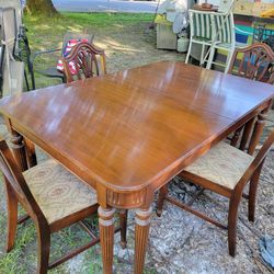 Vintage dining table with 2 leaves 4 chairs and padding