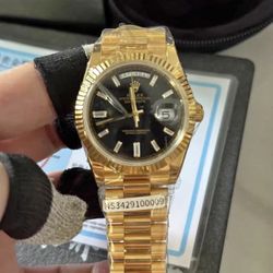 (Watch $450)Rolex Datejust with gold bezel and black dial