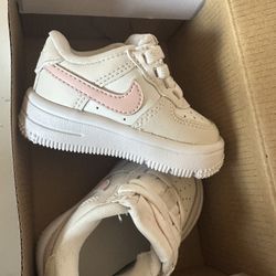 Baby Nikes size 2