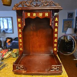 This is an old stand to place a Buddha. I am not sure how to call it.  It is 28 inches height  by 18.5 inches wide