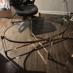 Glass table with gold accents