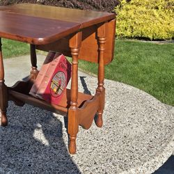 MCM hard rock maple table with a built in book stand with extendable very good to excellent condition