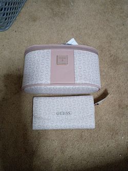Guess travel accessory set, featuring a vanity case and a matching trifold wallet.