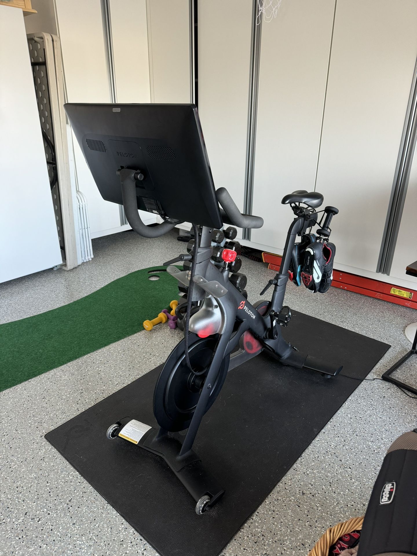 Peloton Bike, Mat, 3lb Weights And Shoe Holder.