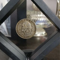 Hobo quarter,  hand carved.