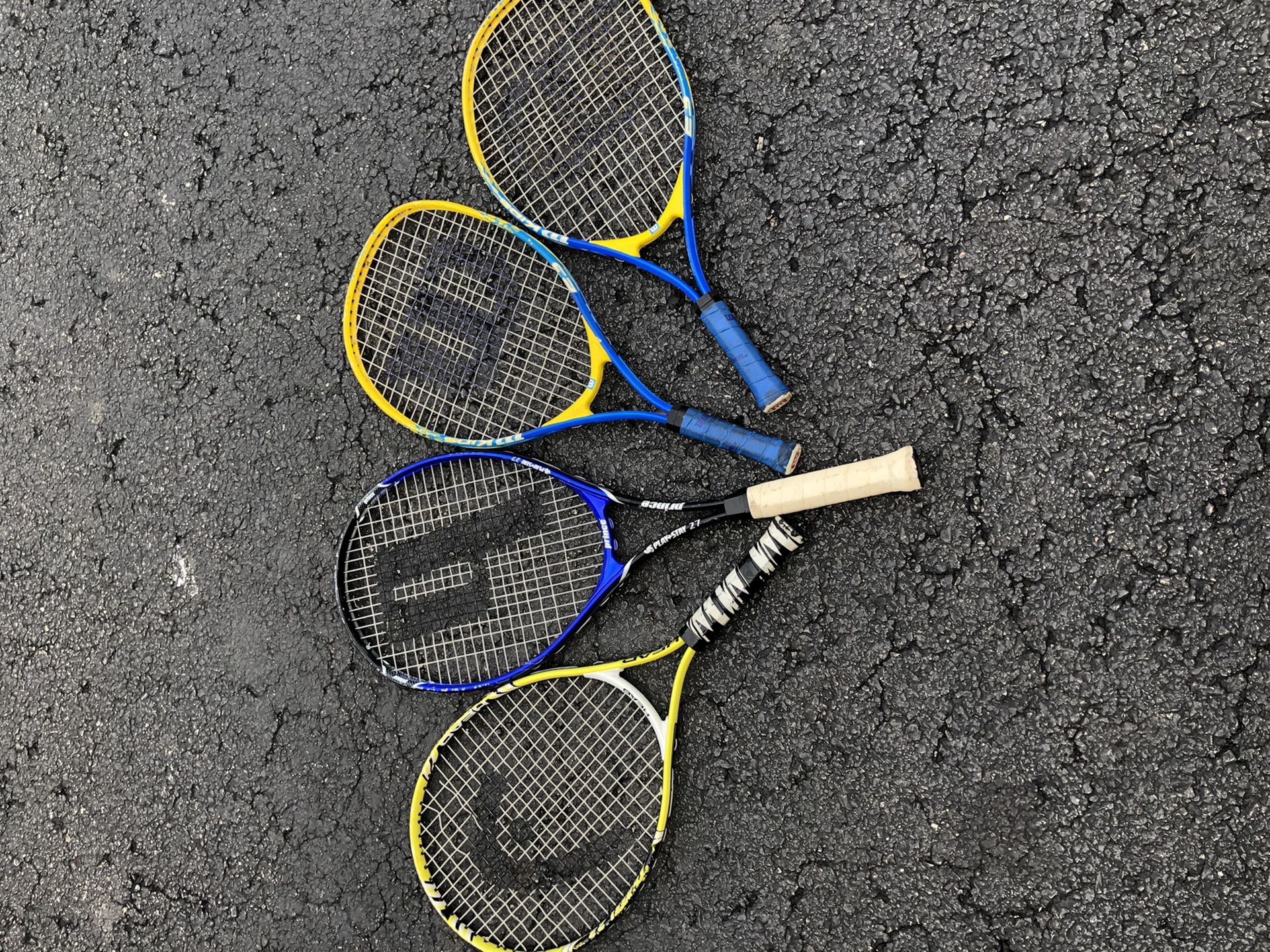 Four tennis rackets