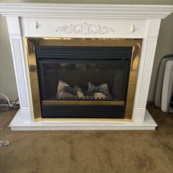 White Trimmed In Gold Fireplace